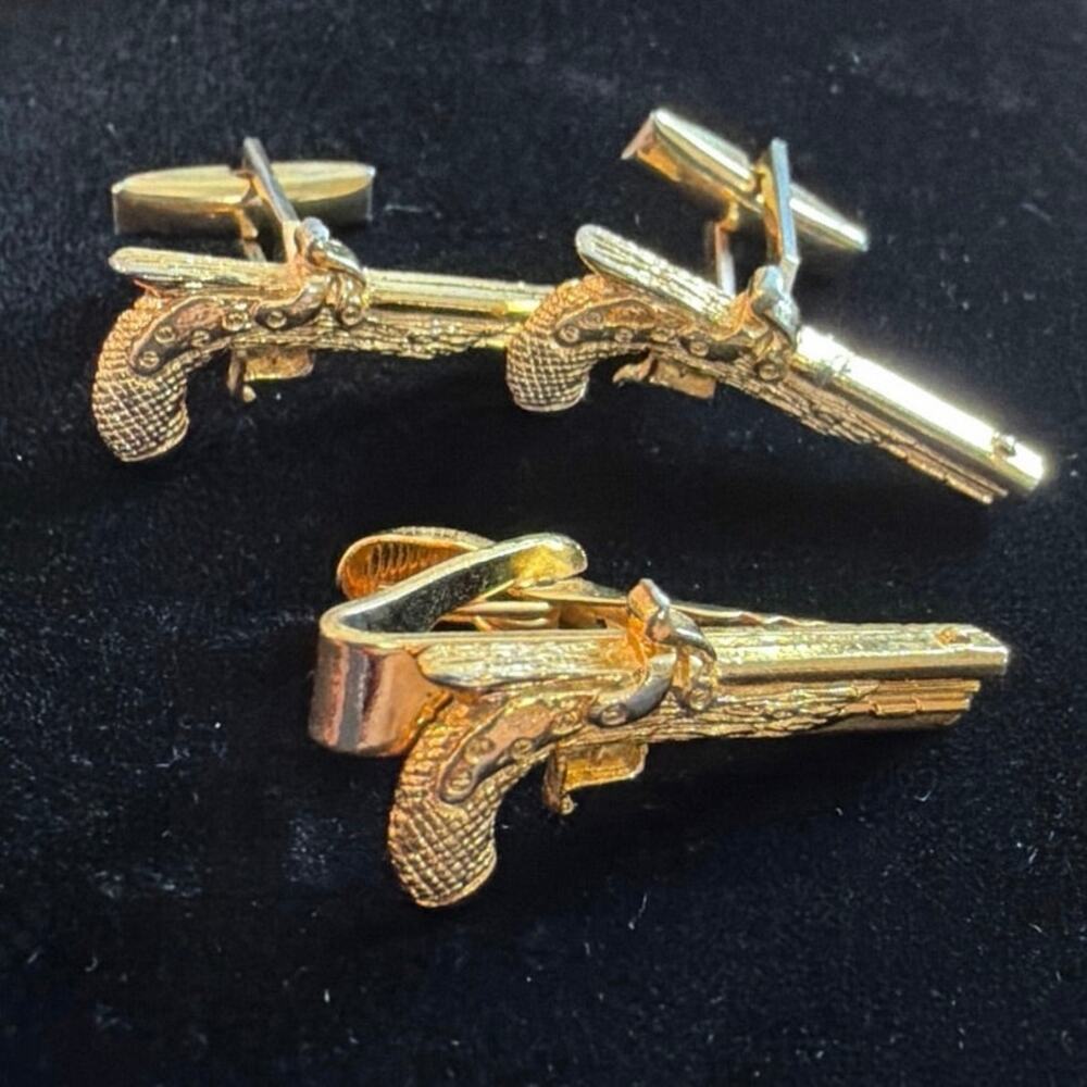 Gold tone revolver gun tie clip and cuff links